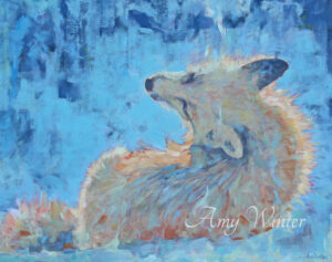 fox lying down against blue background
