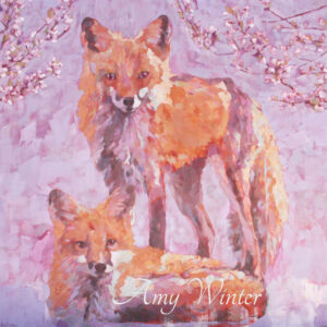 two foxes looking at the viewer