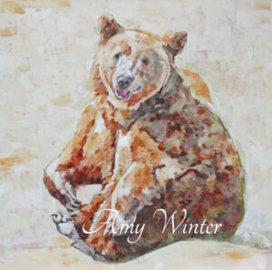 smiling bear sitting on snow