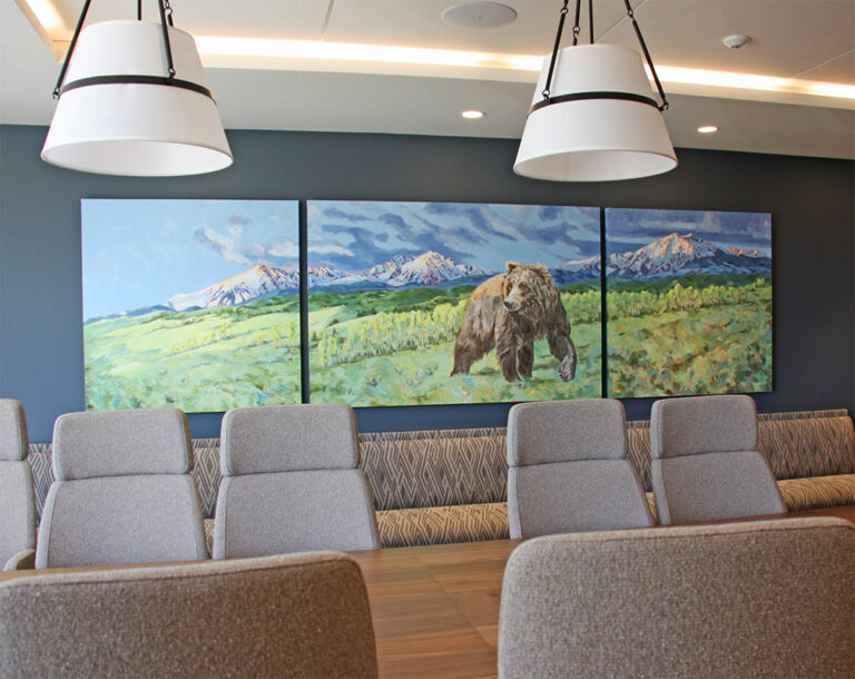 Tryptic of a Kodiak bear in a meadow, snow capped mountain behind
